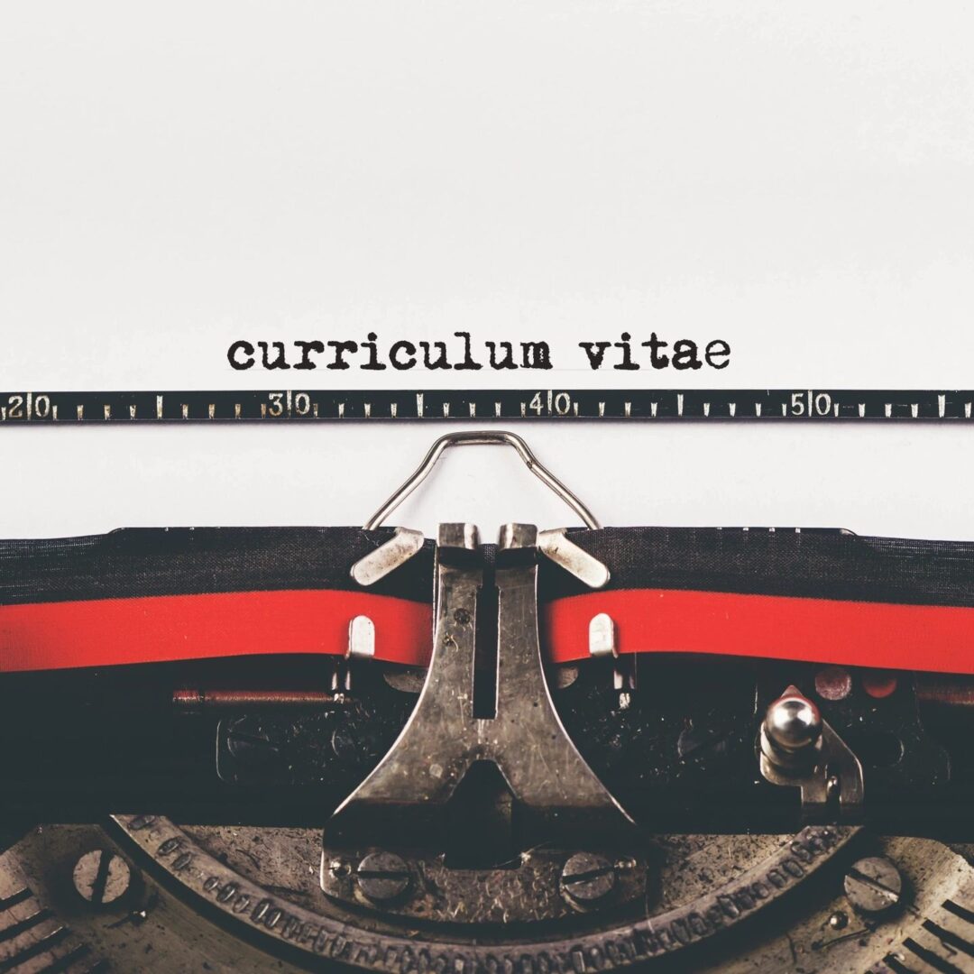 A typewriter with the words curriculum vitae written on it.